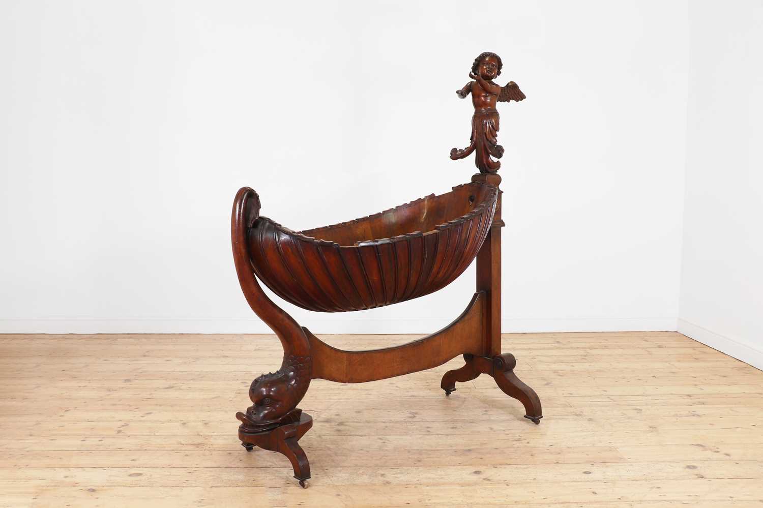 Lot 163 - A rococo carved walnut cradle