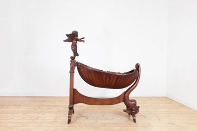 Lot 163 - A rococo carved walnut cradle