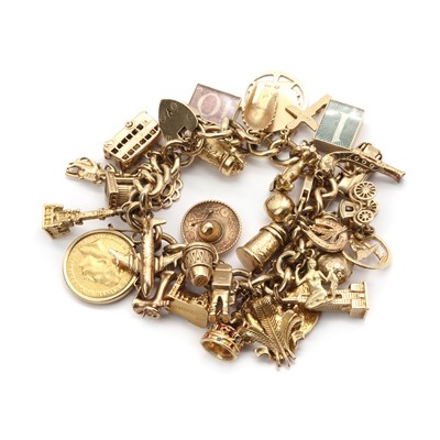 Lot 149 - A gold charm bracelet