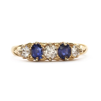 Lot 9 - A gold five stone sapphire and diamond ring