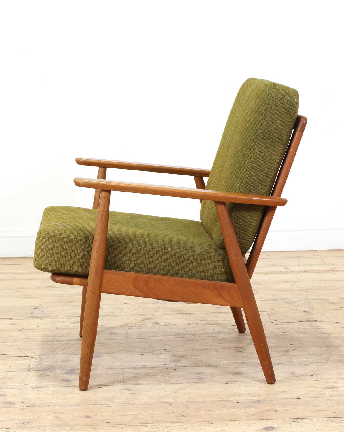 Lot 392 A Danish teak lounge chair,