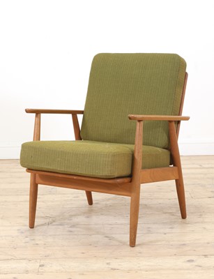 Lot 392 - A Danish teak lounge chair