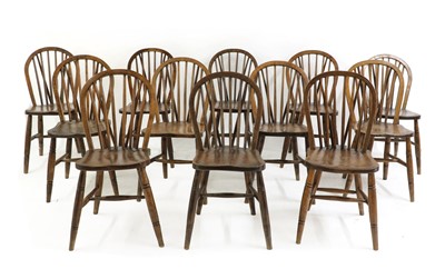 Lot 536 - A harlequin set of twelve elm, ash and beech spindle back Windsor chairs of royal interest