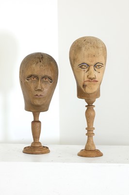 Lot 544 - A pair of carved wooden wigmaker's heads