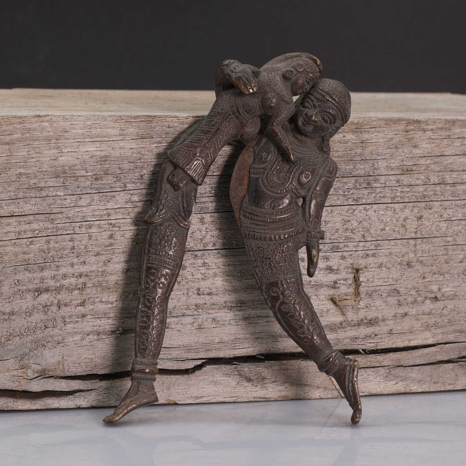 Lot 207 An Indian bronze betel nut cracker,