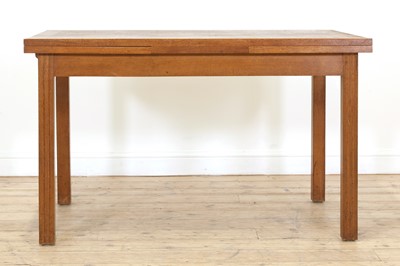 Lot 215 - A Gordon Russell oak dining suite