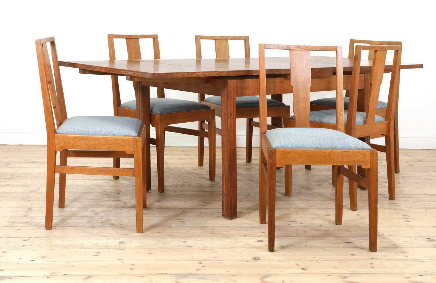 Lot 215 - A Gordon Russell oak dining suite