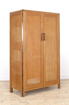 Lot 213 - A Gordon Russell crossbanded oak wardrobe