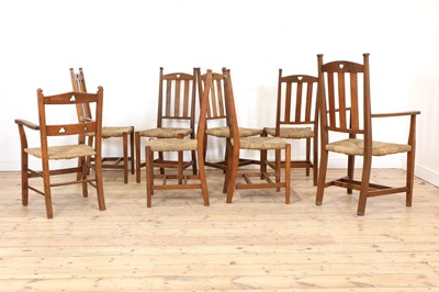 Lot 23 - A set of six rush seat chairs and an armchair