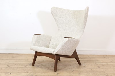 Lot 401 - A Danish upholstered wingback armchair