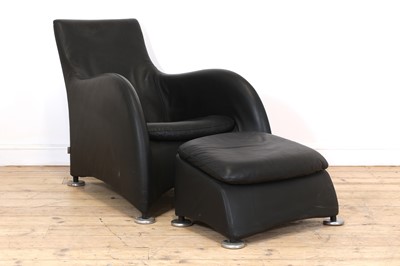 Lot 477 - A leather lounger and ottoman