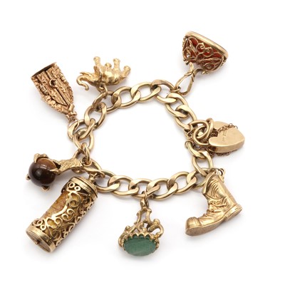 Lot 152 - A 9ct gold charm bracelet