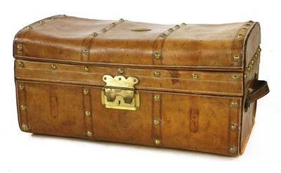 Lot 390 - A leather and brass-studded trunk
