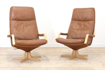 Lot 343 - A pair of Swedish tan leather loungers