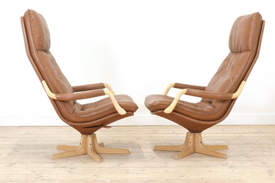 Lot 343 - A pair of Swedish tan leather loungers