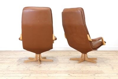 Lot 343 - A pair of Swedish tan leather loungers