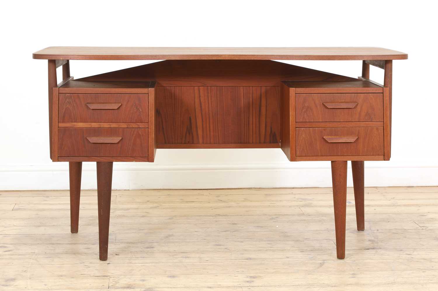 Lot 353 - A Danish teak desk