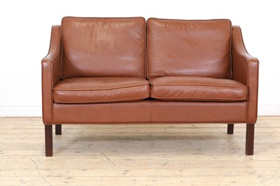 Lot 323 - A Danish brown leather two-seater settee