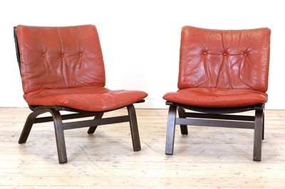 Lot 487 - A pair of Danish red leather loungers