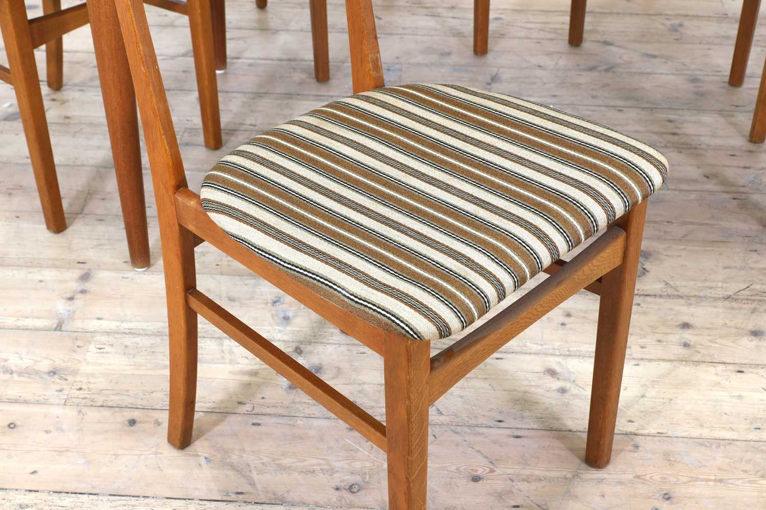 Lot 376 A Danish teak drawleaf dining table and six