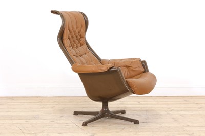 Lot 449 - A Danish brown moulded plastic and tan leather lounger