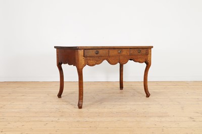 Lot 321 - A fruitwood writing table