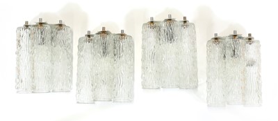 Lot 486 - A set of four textured 'bark' glass wall lights