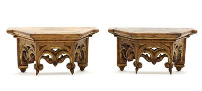 Lot 510 - A pair of oak and parcel-gilt wall brackets in the Gothic-style