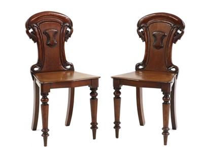 Lot 605 - A pair of Victorian mahogany hall chairs