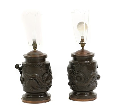 Lot 314 - A pair of Japanese patinated bronze table lamps