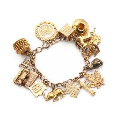 Lot 150 - A gold charm bracelet