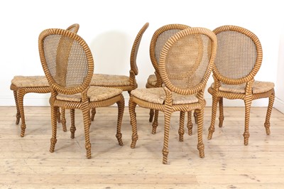 Lot 557 - A set of six blonde wood dining chairs