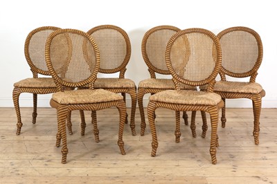 Lot 557 - A set of six blonde wood dining chairs