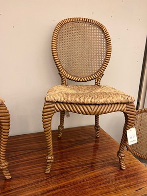 Lot 557 - A set of six blonde wood dining chairs