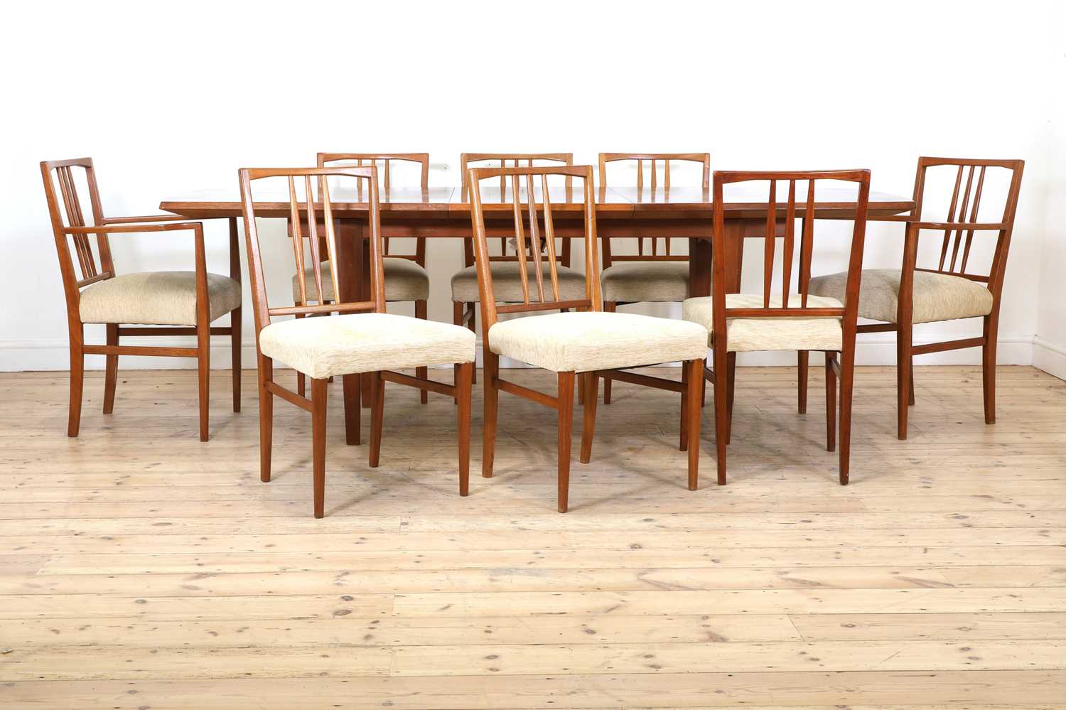 Lot 250 - A Gordon Russell teak and walnut dining table and eight chairs