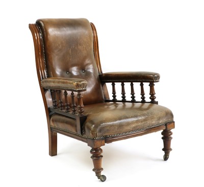 Lot 564 - A late Victorian walnut and leather upholstered library chair
