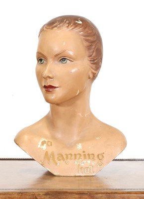 Lot 170 - A composition and painted advertising bust