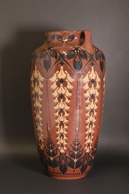 Lot 78 - A glazed earthenware two-handled vase