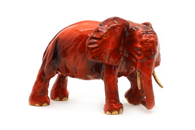 Lot 331 - A Michael Sutty porcelain red glazed elephant