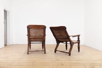 Lot 305 - A near pair of teak planters' chairs