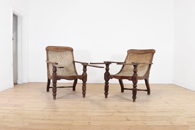 Lot 305 - A near pair of teak planters' chairs