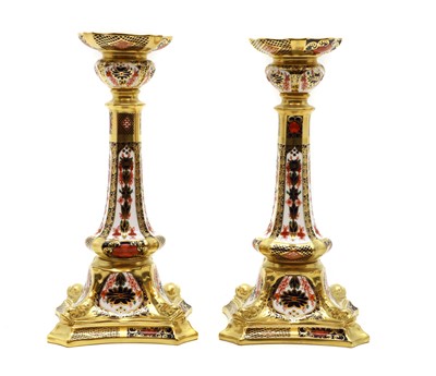 Lot 350 - A pair of Royal Crown Derby porcelain candlesticks