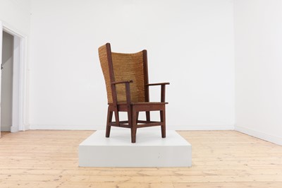 Lot 486 - An oak, straw and seagrass armchair