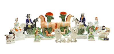 Lot 357 - A group of Staffordshire pottery figures