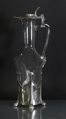 Lot 85 - An Art Nouveau pewter and glass claret jug