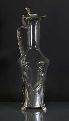 Lot 85 - An Art Nouveau pewter and glass claret jug