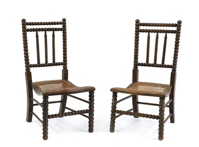 Lot 499 - A pair of oak bobbin chairs