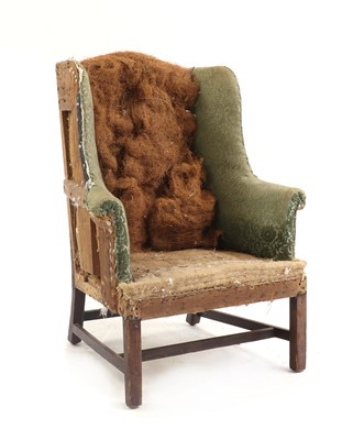 Lot 482 - A George III wing armchair