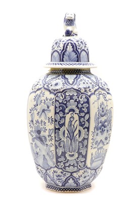 Lot 395 - A Delft porcelain blue and white vase and cover