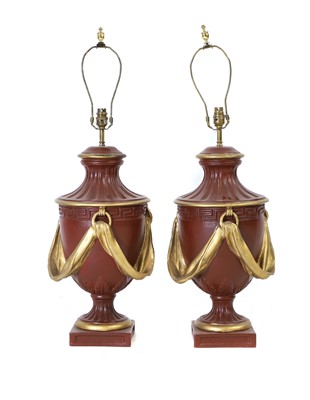 Lot 435 - A pair of resin Classical style lamps